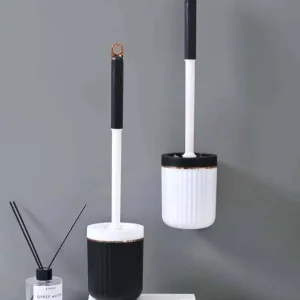 فرشاة حمام مع قاعدة بلاستيك وتصميم ذهبي للتثبيت على الجدار